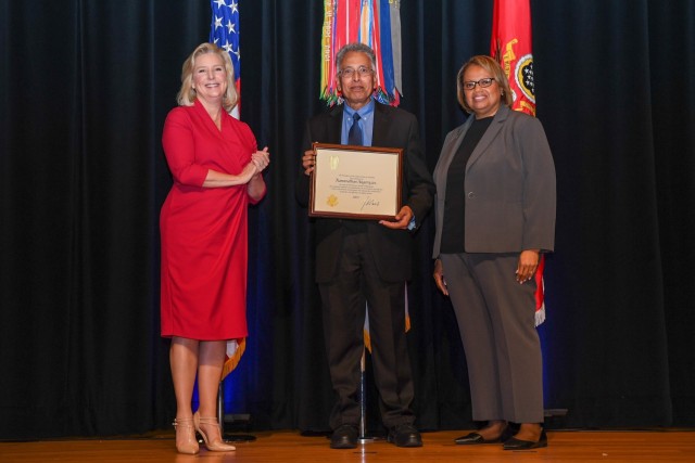 Dr. Ramanathan Nagarajan receives a Meritorious Senior Professional Award from Army Secretary Hon. Christine E. Wormuth.