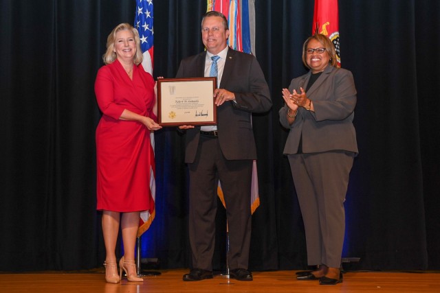 Dr. Robert Sadowski receives a Meritorious Senior Professional Award from Army Secretary Hon. Christine E. Wormuth