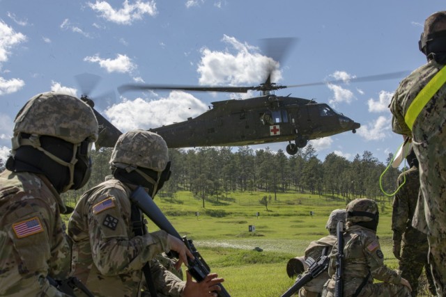 U.S. Army Soldiers, 1138th Engineering Company, Missouri Army National Guard, simulate a medical evacuation during the 2019 Golden Coyote Exercise at Rapid City, S.D., June 15, 2019. The Golden Coyote Training Exercise is a three-phase, scenario-driven exercise conducted in South Dakota and Wyoming, which enables commanders to focus on mission essential task requirements, warrior tasks and battle drills. 