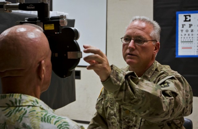 Maj. Larry Decker, an optometrist in the U.S. Army Reserve assigned to the 94th Combat Support Hospital, 807th Medical Command (Deployment Support) out of Seagoville, Texas, performs an eye exam during Tropic Care 2018 in Kea’au, Hawaii, June 23, 2018. Tropic Care 2018 is an Innovative Readiness Training event that runs from June 18-28 designed to increase Soldier readiness while also serving the community of Kea’au, and its surrounding areas. 