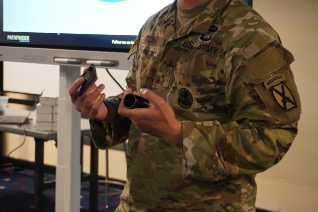                              WO1 Ton demonstrates his capstone project during the Basic Additive Manufacturing course offered at the Airborne Innovation Lab.  