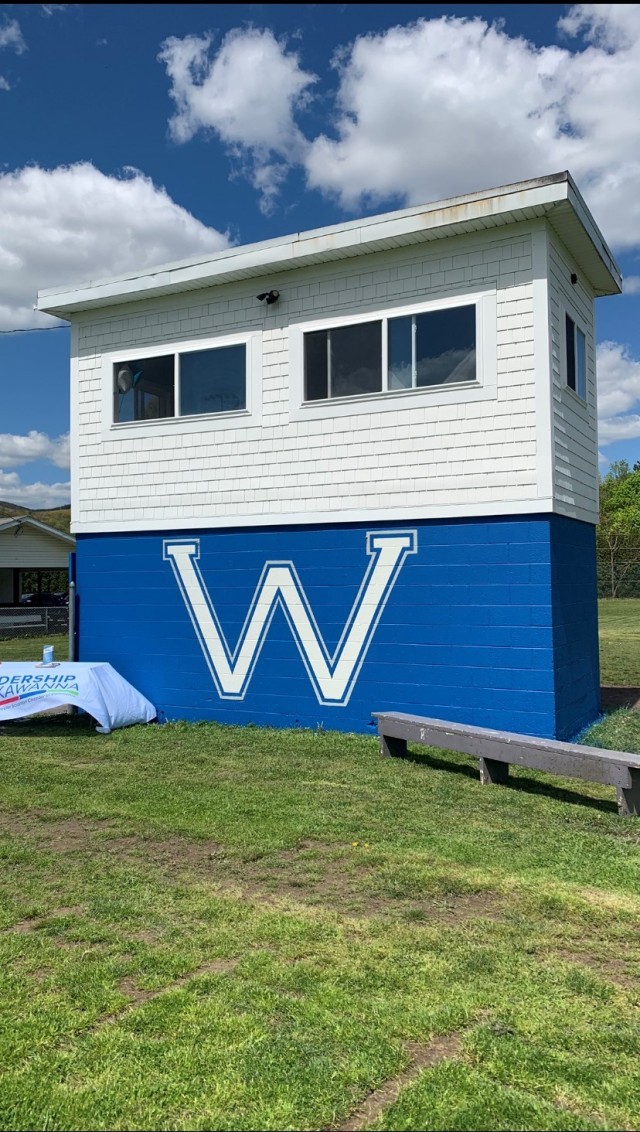 The newly renovated West Scranton Jr. Invaders&#39; press box is seen. The top half is white and the bottom half is blue with a white W on it.