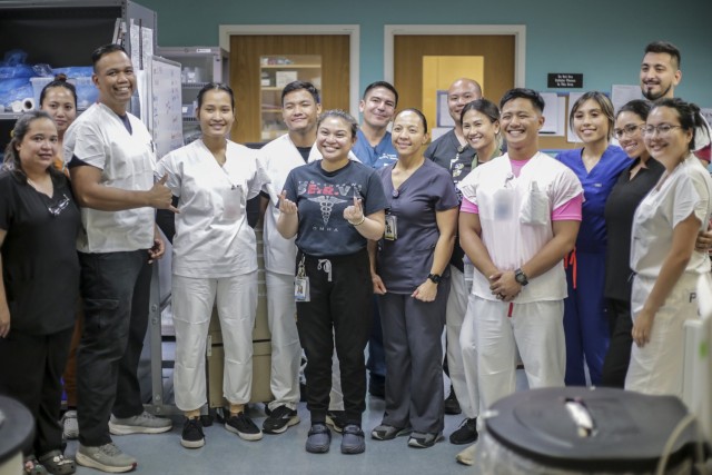 Combat medics from the Guam National Guard and members of the Guam Memorial Hospital emergency room staff work together in the wake of Typhoon Mawar June 21, 2023. 