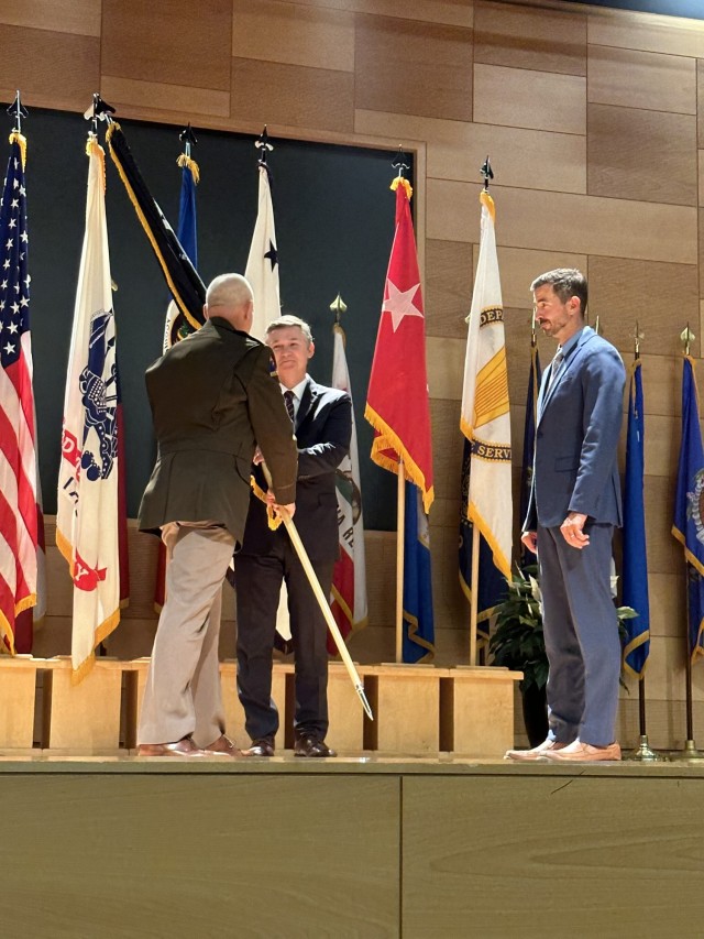 Maj. Gen. Anthony Potts relinquishes the PEO C3T charter to Mr. Mark Kitz, presided by the Honorable Douglas R. Bush, ASA(ALT) on June 29, 2023. 