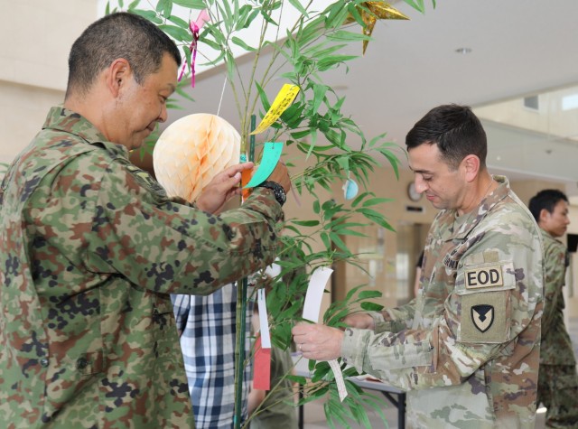 Command Sgt. Maj. David A. Rio, right, senior enlisted leader of U.S. Army Garrison Japan, and Warrant Officer Daisuke Chiba, senior enlisted leader of 4th Engineer Group, celebrate the &#34;Tanabata&#34; festival during an event at Camp Zama, Japan, June 29, 2023. The Japan Ground Self-Defense Force&#39;s 4th Engineer Group hosted the event and invited community members to participate in the celebration.