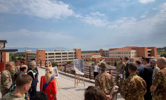 Ms. Anna Ciccotti, U.S. Army Garrison Italy Community & Media Relations officer, briefs guests on improvements made to Caserma Del Din military base since its opening during an overview of the base on Jun. 30, 2023. Members of the Vicenza military...