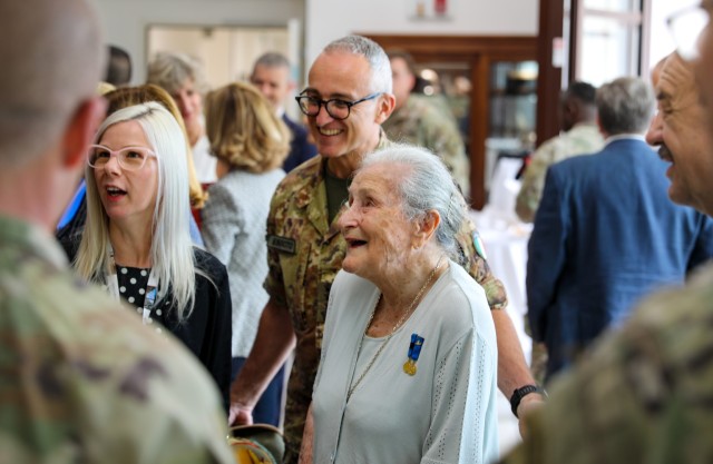 Guest of honor, Ms. Paola Del Din, center, speaks with members of the Vicenza military community in the SETAF-AF headquarters. U.S. Army Southern European Task Force, Africa (SETAF-AF) and the 173rd Airborne Brigade, as well as local Vicenza...