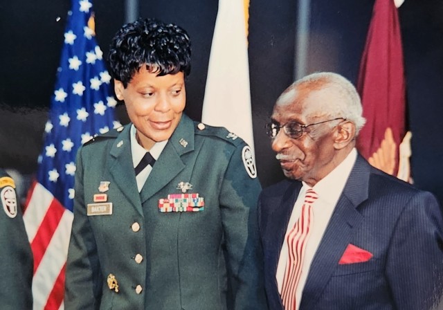 Newly promoted Brig. Gen. Sheila Baxter, stands next to her father John Baxter Sr., of Franklin, Virginia, during her promotion ceremony June 21, 2003 at the Women in Military Service to America Memorial in Arlington. Baxter was the first female general officer in the Medical Service Corps. 