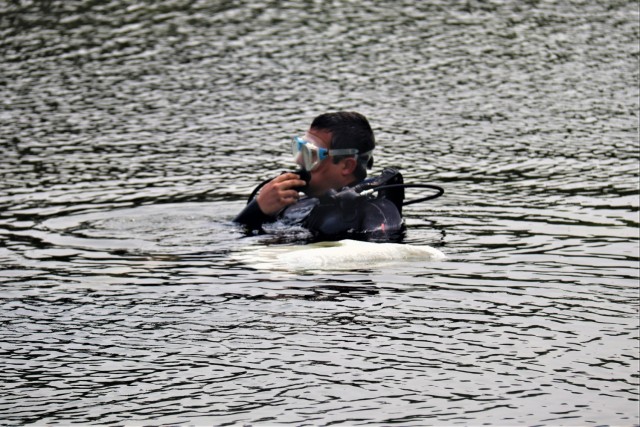 Fort McCoy biologists go diving to curb invasive plant species