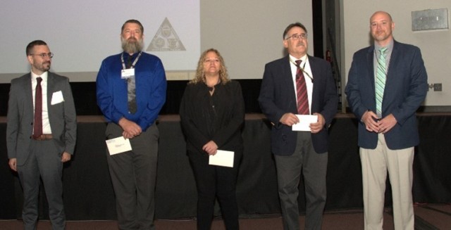 Information Systems Security Program Team members were presented with three-star notes of appreciation during the GIPC.