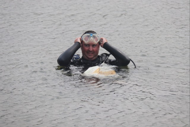 Fort McCoy biologists go diving to curb invasive plant species