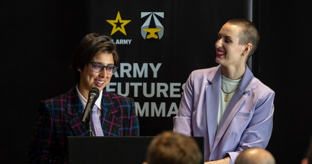 Army Futures Command staff members Leah Lucio and Alex Vermooten deliver remarks during the command’s Pride Month observance in Austin, Texas, June 28, 2023. 