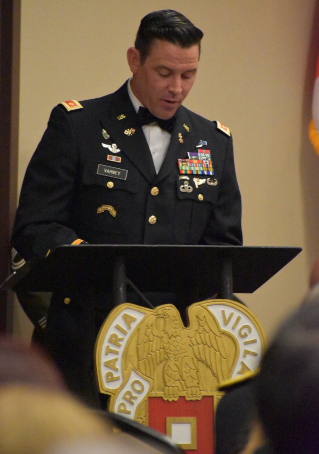 Maj. Joshua Varney, U.S. Army Signal School, serves as narrator for the 2023 Distinguished Members of the Regiment induction ceremony.