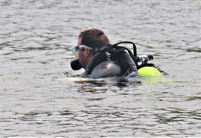 Fort McCoy biologists go diving to curb invasive plant species