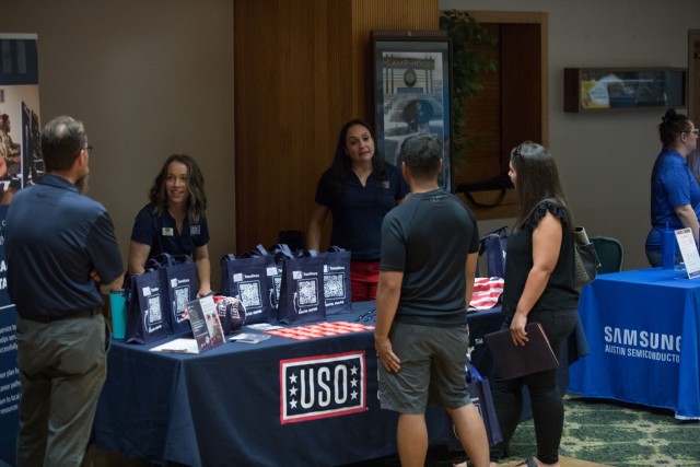 Spouses talk to USO representatives at the Spouses Career Fair June 27 at the Phantom Warrior Center. Over 40 different organizations and companies were represented at the event with career options including teaching, business administration and law enforcement. (U.S. Army photo by Blair Dupre, Fort Cavazos Public Affairs)