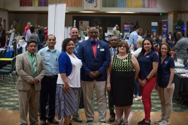 Spouses Career Fair organizers representing different organizations, including the Fort Cavazos Transition Assistance Program, Texas Workforce Commision and the USO, pose for a photo before the event begins June 27 at the Phantom Warrior Center.  (U.S. Army photo by Blair Dupre, Fort Cavazos Public Affairs)