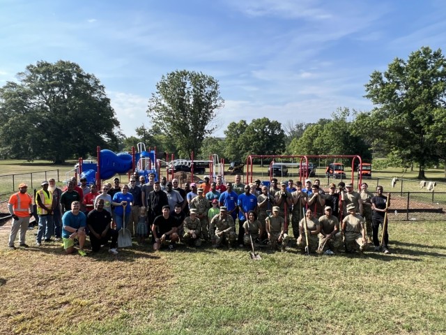 June 26, 2023 -- Fort Meade community members pitch-in spreading mulch to restore KABOOM playground.