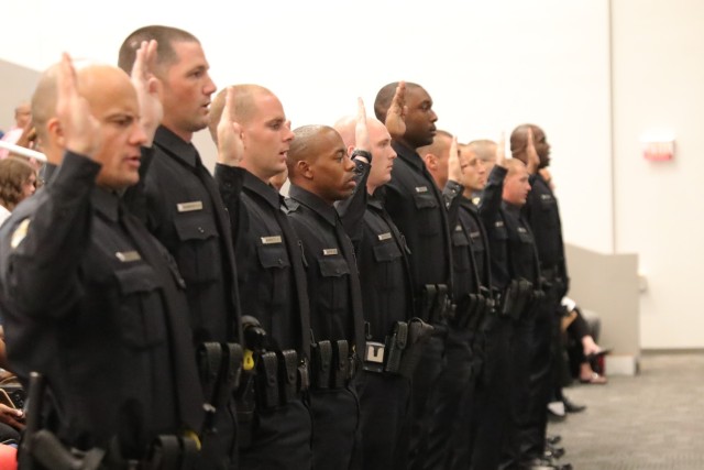 The 13 graduates of the Huntsville Police Department’s 68th Session Academy take their Oath of Service to officially join the HPD at the Alabama School of Cyber, Technology and Engineering.
