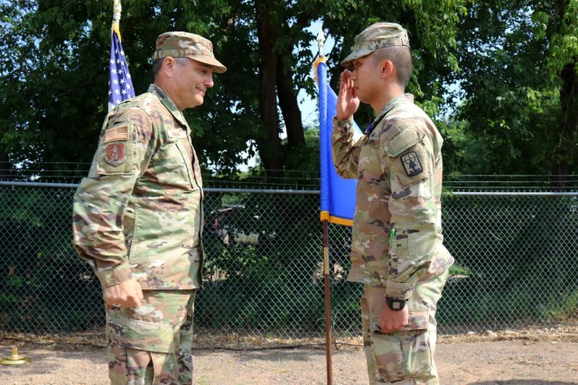 1First Lt. Apiwit B. Chulawan, an officer with the Wisconsin Army Naitonal Guard’s 829th Engineer Vertical Construction Company, salutes Maj. Gen. Paul Knapp, Wisconsin’s adjutant general, after being awarded the Soldier’s Medal during a July 9, 2023, ceremony in Spooner, Wis. Chulawan was a passenger on a train that derailed in 2021 and helped aid injured passengers. Wisconsin National Guard photo by Staff Sgt. Alice Ripberger