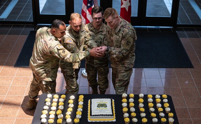 Fort Leonard Wood’s warrant officers celebrated 105 years of the Army Warrant Officer Corps with a birthday cake-cutting ceremony Wednesday in Hoge Hall. Ceremoniously cutting the cake are, from left; MSCoE Command Sgt. Maj. Jorge Arzabala; Chief Warrant Officer 5 Mark Arnold, most senior warrant officer; Warrant Officer Pierce Fryga, most junior warrant officer; and MSCoE Commanding General Maj. Gen. Christopher Beck.