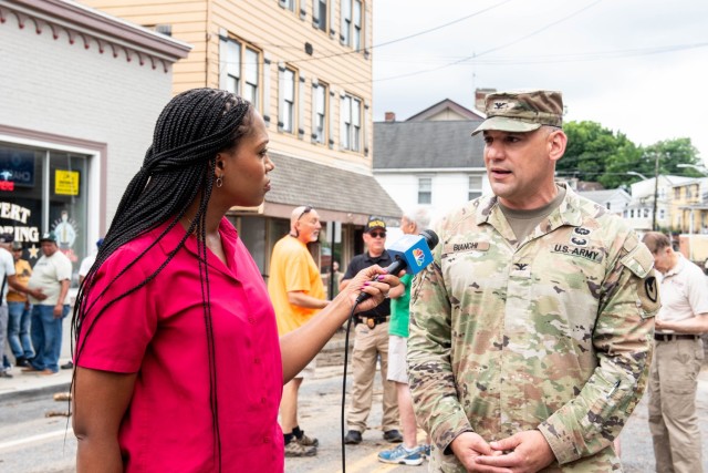 Col. Anthony Bianchi speaking with media during a press conference after the flash flood. 