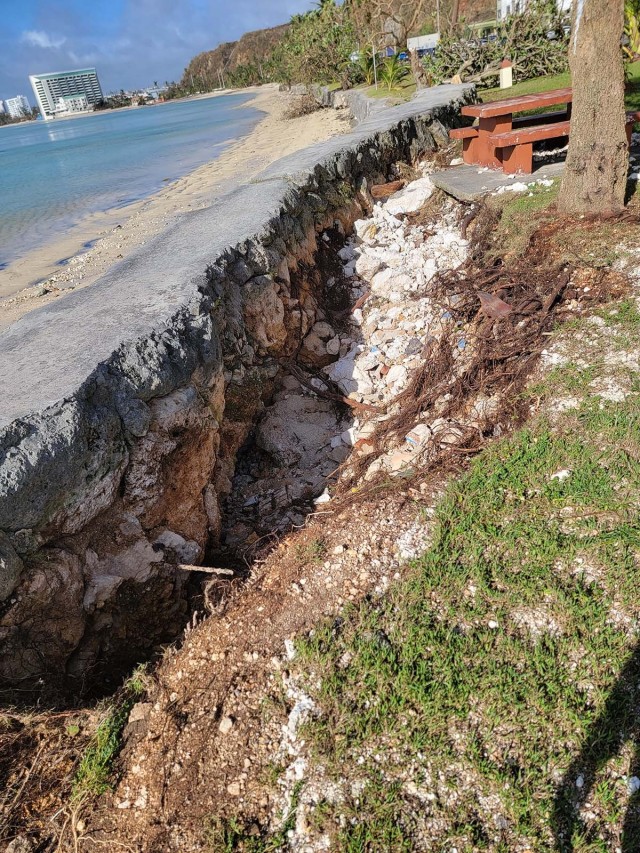 Erosion and undermining of the existing seawall built to protect the roadway is visible within the study area.