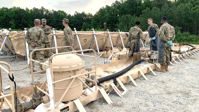 Defense Logistics Agency Joint Reserve Force Army Staff Sgt. Beal (second from left) works with U.S. Army Reservists from 1001st Quartermaster Company at a fuel system supply point on Fort Barfoot, Virginia, during the U.S. Army Reserve’s 2023...
