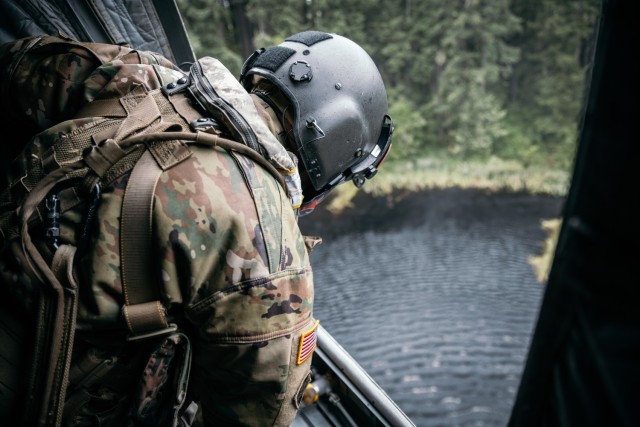 Washington National Guard Sgt. Nathan Smart a member of B Company, 1st Battalion, 168th General Support Aviation, checks the water bucket level during wildfire air operations training June 6, 2021, at Joint-Base Lewis McChord, Washington.