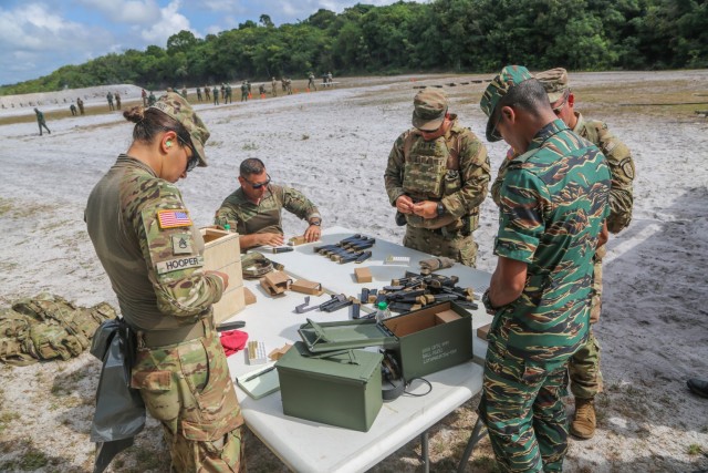 Florida National Guard Soldiers from the 54th Security Force Assistance Brigade prepare for a live-fire exercise to train multinational partners from Guyana, Antigua and Barbuda Merchant Marines at Camp Seweyo, Guyana, July 21, 2023.