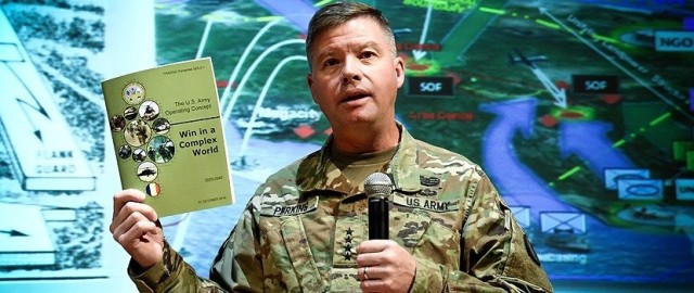 General David G. Perkins, TRADOC’s 15th Commanding General, holding a copy of one of the pamphlets that contributed to establishing MDO