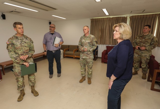 Patricia Coury, right, deputy assistant secretary of defense for housing, tours a barracks building at Camp Zama, Japan, July 20, 2023. Coury had a firsthand look at the housing options USAG Japan provides, including some locations at Sagamihara Family Housing Area.