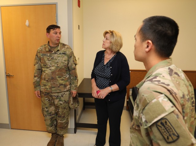 Patricia Coury, center, deputy assistant secretary of defense for housing, tours a barracks building at Camp Zama, Japan, July 20, 2023. Coury had a firsthand look at the housing options USAG Japan provides, including some locations at Sagamihara Family Housing Area.