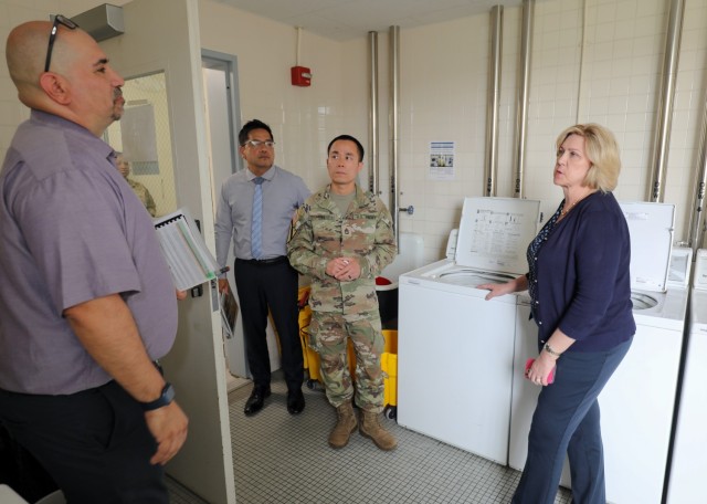 Patricia Coury, right, deputy assistant secretary of defense for housing, tours a barracks building at Camp Zama, Japan, July 20, 2023. Coury had a firsthand look at the housing options USAG Japan provides, including some locations at Sagamihara Family Housing Area.