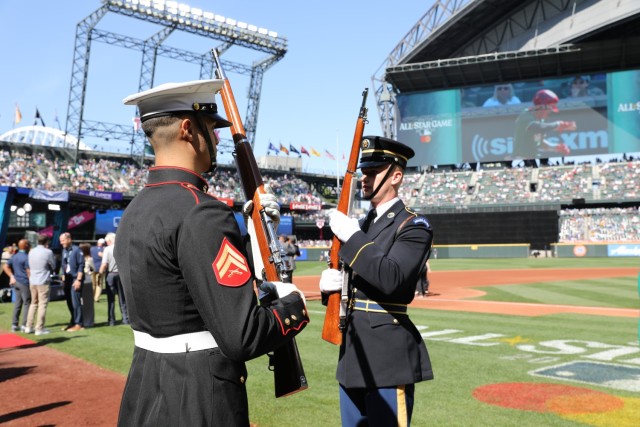 Members of the Joint Armed Forces Color Guard rehearse just before presenting the colors at the 2023 Major League Baseball All-Star Game on July 11, 2023 in Seattle.