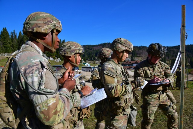U.S. Army Paratroopers assigned to the 173rd Airborne Brigade, plot a point on a map for a land navigation event as part of the Expert Infantryman Badge, Expert Soldier Badge and Expert Field Medical Badge training at Campomulo Asiago, Vicenza, Italy, Oct 26, 2022. Candidates will demonstrate their individual proficiency in navigation from one point to another, while dismounted without the aid of electronic navigation devices. The 173rd Airborne Brigade is the U.S. Army Contingency Response Force in Europe, capable of projecting ready forces anywhere in the U.S. European, Africa or Central Commands' areas of responsibility. (U.S. Army photo by Paolo Bovo)