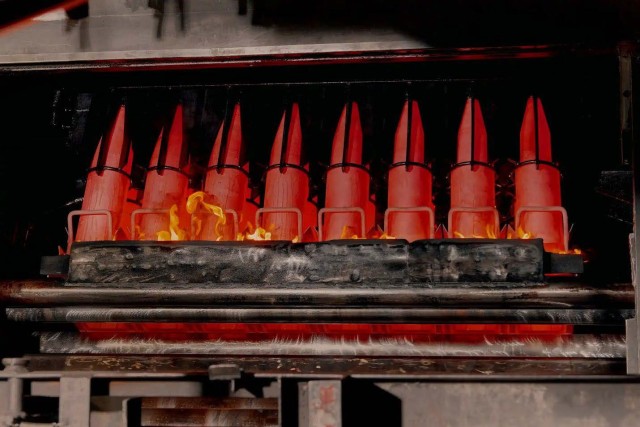 Artillery shells stand over an oil &#34;bath&#34; that&#39;s designed to cool them before the final stages of assembly at Scranton Army Ammunition Plant.