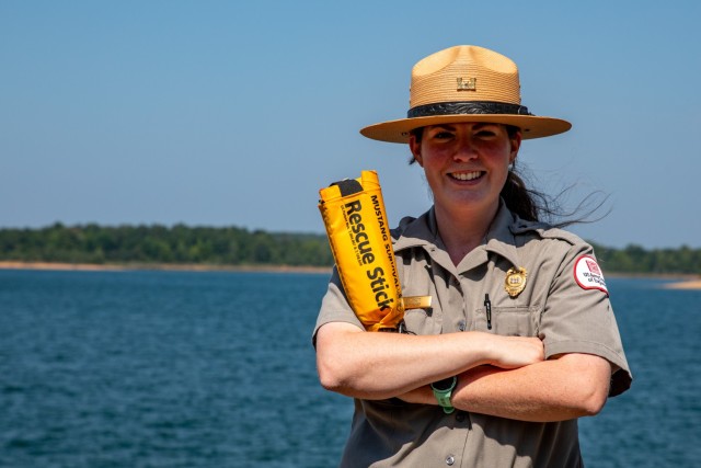 Greers Ferry Lake Park Ranger, Sarah Wyatt, holds a Mustang Survival Rescue Stick at Trouble Island on Greers Ferry Lake near Heber Springs, Arkansas.