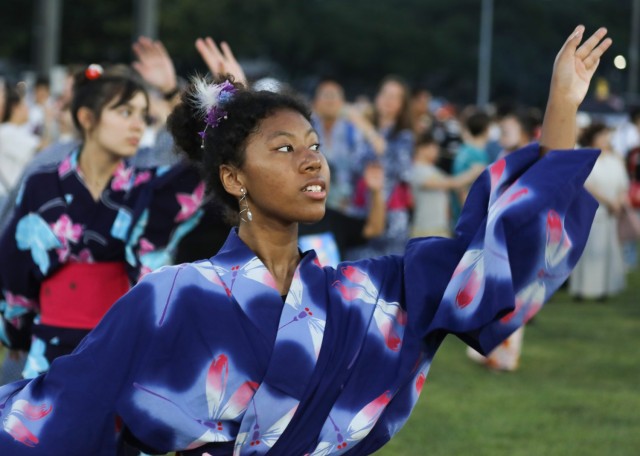 Kiera White, who will attend ninth grade at Zama Middle High School, dances around the bon tower during the Bon Odori festival at Camp Zama, Japan, Aug. 5, 2023. About 20,000 people attended this year&#39;s event, which honors the departed spirits of one’s ancestors. The traditional Japanese festival has been celebrated at Camp Zama since 1959.