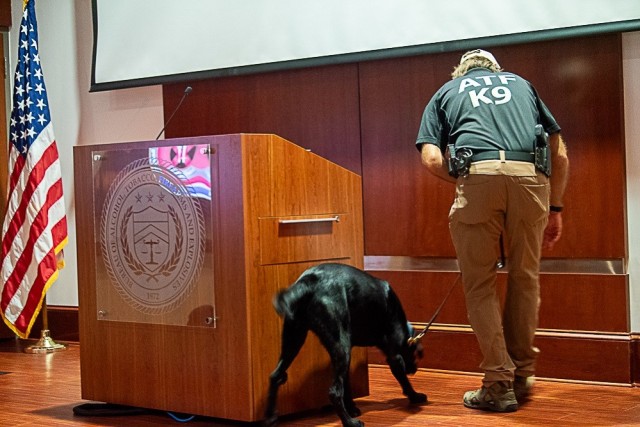 ATF Special Agent Canine Handler David Wiley demonstrates an explosion sweep with explosives detection K9 Ranger during the Trash Pandas visit. 