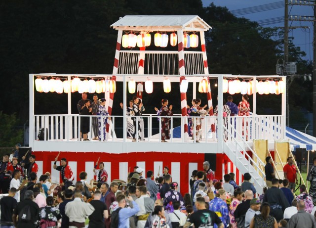Bon Odori festival attendees dance on and around a bon tower at Camp Zama, Japan, Aug. 5, 2023. About 20,000 people attended this year&#39;s event, which honors the departed spirits of one’s ancestors. The traditional Japanese festival has been celebrated at Camp Zama since 1959.