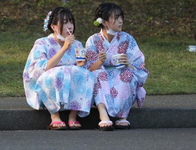 A pair of Japanese girls dressed in yukatas attend the Bon Odori festival at Camp Zama, Japan, Aug. 5, 2023. About 20,000 people attended this year&#39;s event, which honors the departed spirits of one’s ancestors. The traditional Japanese festival has been celebrated at Camp Zama since 1959.