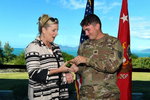 The Secretary of the Army Christine Wormuth receives a unit coin from Capt. Jared McCully during his promotion ceremony to captain in Bowen, Australia, July 29, 2023. Wormuth was in Australia to observe Joint Logistics Over-the-Shore, one of the many critical sustainment capabilities rehearsed during Talisman Sabre 2023. During Wormuth’s visit, McCully was one of a handful of Soldiers to be promoted and recognized by the Secretary of the Army.