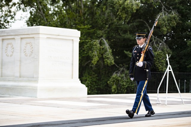 Tomb guard U.S. Army Pfc. Jessica Kwiatkowski from the 3d U.S. Infantry Regiment (The Old Guard) walks the mat at the Tomb of the Unknown Soldier at Arlington National Cemetery, Arlington, Va., Aug. 2, 2023.