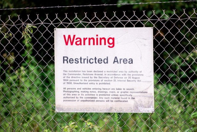 Warning signs line the fences along the boundaries of one of Redstone Arsenal’s test ranges. These large parcels of land are used to test and/or demolish a variety of items throughout the year.