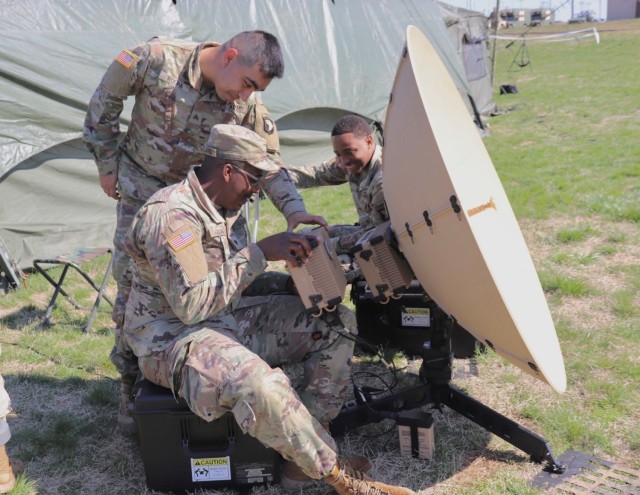 Soldiers with the 3rd Brigade Combat Team, 101st Airborne Division (Air Assault) set up satellite communications.