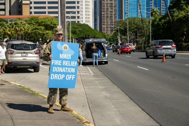 A Soldier directs traffic in support of donations for those affected by the Maui wildfires.