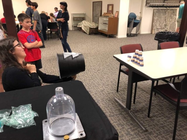 Stephanie Maruca Donnelly, a physicist for the U.S. Army Combat Capabilities Development Command Armaments Center, performs science demonstrations at schools, libraries and community events. One demonstration uses air pressure to knock over a tower of cups. 