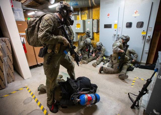 Members of the Anchorage Police Department SWAT unit work through an active shooter/hostage scenario on the UAA campus June 13, 2023. The active shooter portion is part of ORCA 2023, a biennial exercise designed to maintain readiness, validate response procedures, and collaborate with first response agencies across the state. The exercise, hosted by the Alaska National Guard’s 103rd Weapons of Mass Destruction - Civil Support Team, included 12 National Guard units from Alaska, Washington, Nebraska, Mississippi, Kansas, Ohio, Hawaii, and Kentucky, eight local and state entities, three federal agencies, and various community partners. 