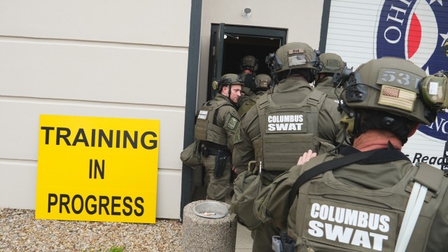 Columbus Division of Police SWAT personnel participate in a simulated active aggressor exercise at the Maj. Gen. Robert S. Beightler Armory in Columbus, Ohio, April 14, 2023. Over 20 organizations participated in a two-day exercise that validated collective response capabilities of state and local law enforcement and other civil authorities during emergency scenarios. Simulated victims and aggressors for the exercise were provided by the Ohio Military Reserve, as well as the Franklin County and Columbus Medical Reserve Corps.