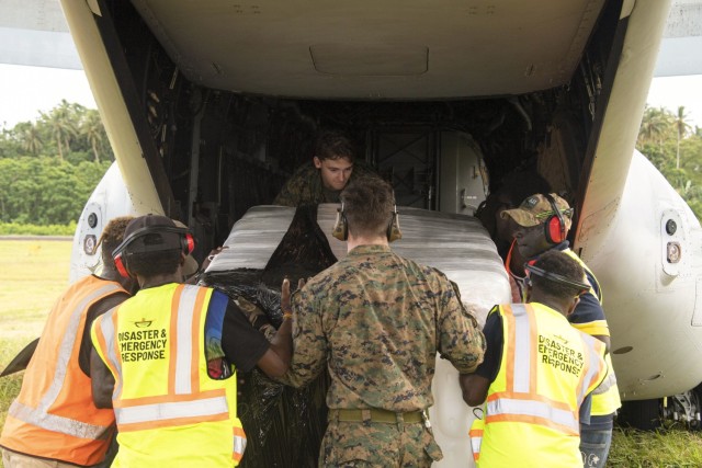 U.S. Marines and Bougainville Disaster Response Joint-Agency personnel load supplies onto an MV-22B Osprey during a humanitarian assistance and disaster relief operation on Bougainville Island, Papua New Guinea, Aug. 12, 2023.